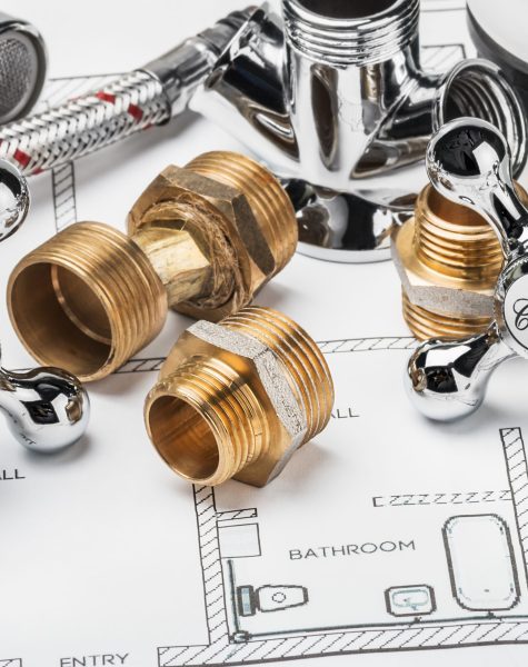 spare parts and tools lying on drawing for repair plumbing